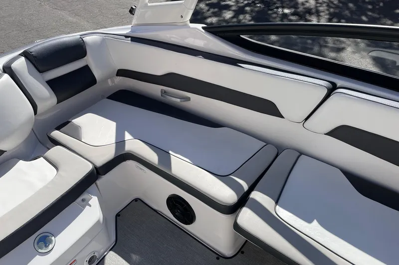 Slide: The Image of 2023 Yamaha Boats AR195 interior seating with sleek, modern design and comfortable upholstery. - 9