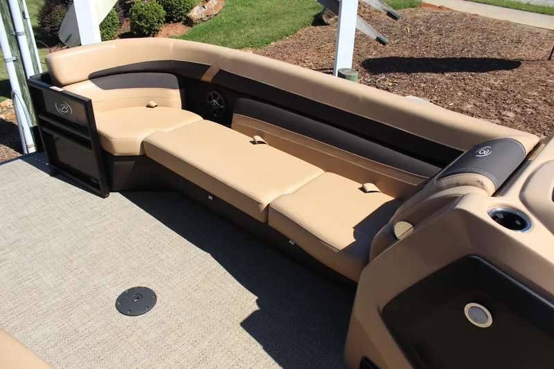 Slide: The Image of Luxurious seating on 2025 Barletta C24UC pontoon boat, featuring beige and black upholstery. - 11