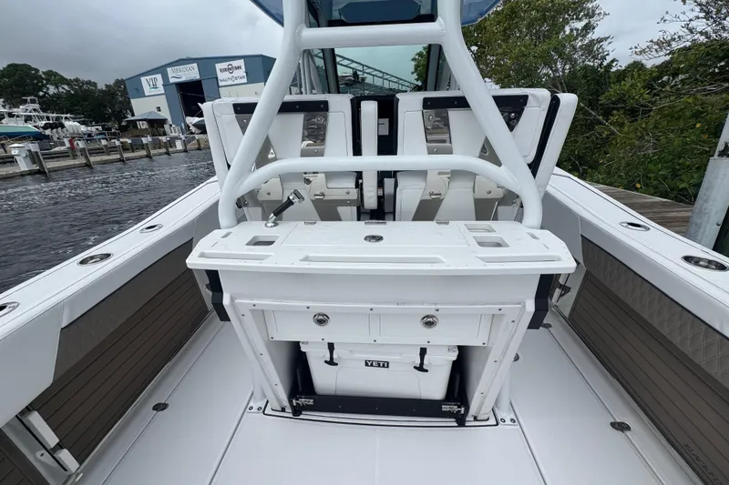 Slide: The Image of 2025 Blackfin 272CC boat interior with fishing station and Yeti cooler. - 14
