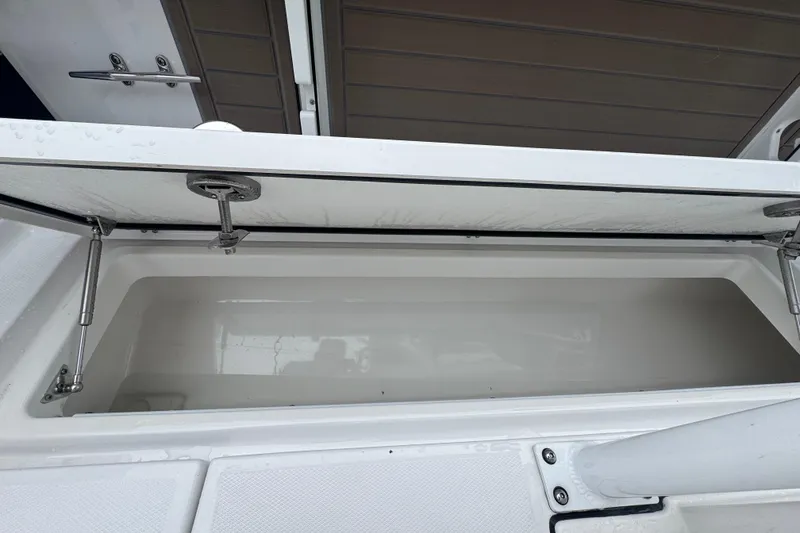 Slide: The Image of Open storage compartment on 2025 Blackfin 272CC boat, showcasing interior space. - 22