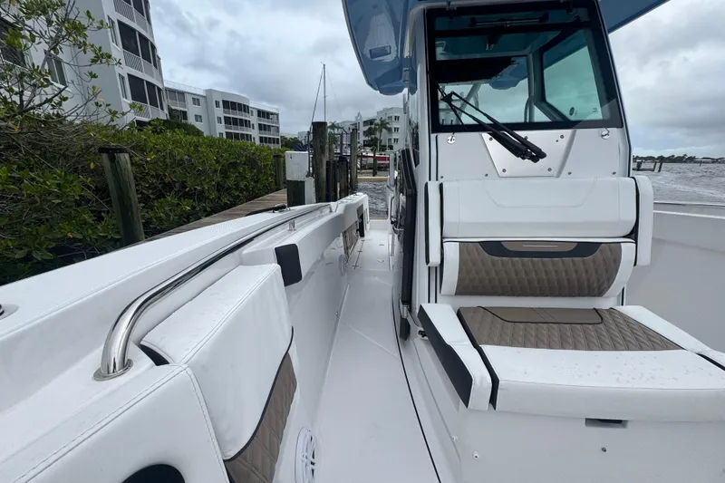Slide: The Image of 2025 Blackfin 272CC boat interior with sleek seating and modern design. - 8