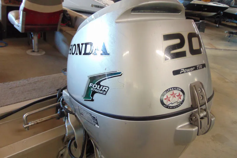 Slide: The Image of Silver Honda 20HP four-stroke outboard motor on 2002 Tracker Super Guide V-15 boat. - 10