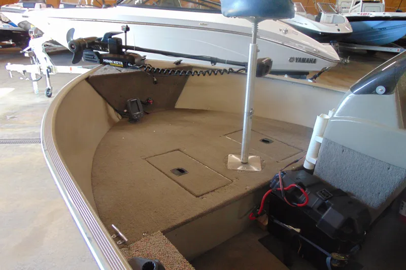 Slide: The Image of 2002 Tracker Super Guide V-15 boat interior with Minn Kota trolling motor. - 12