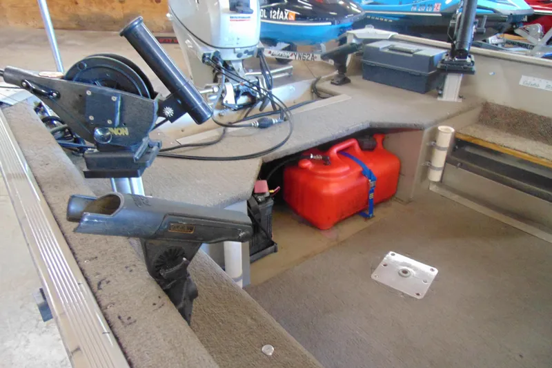 Slide: The Image of 2002 Tracker Super Guide V-15 boat interior with equipment and red fuel tank. - 7