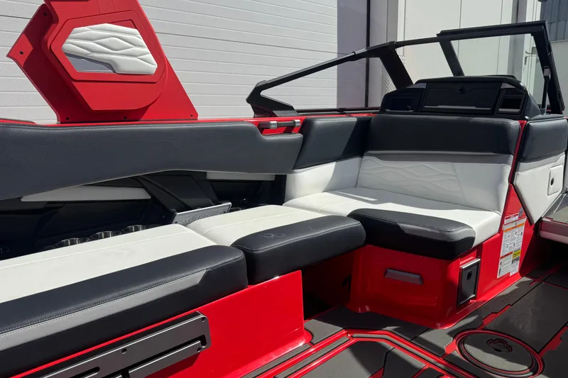 Slide: The Image of 2025 Supra SL 575 boat interior with red and black seating, modern design. - 10