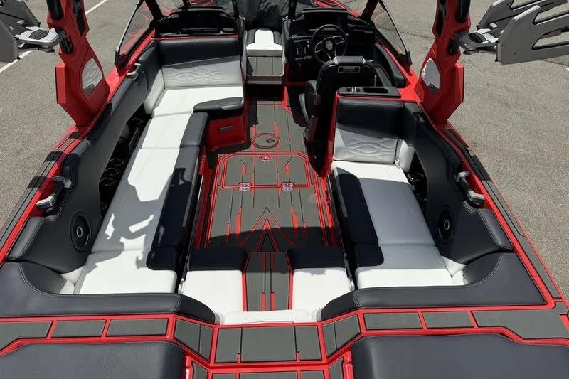 Slide: The Image of 2025 Supra SL 575 boat interior with red and black seating, modern design. - 5