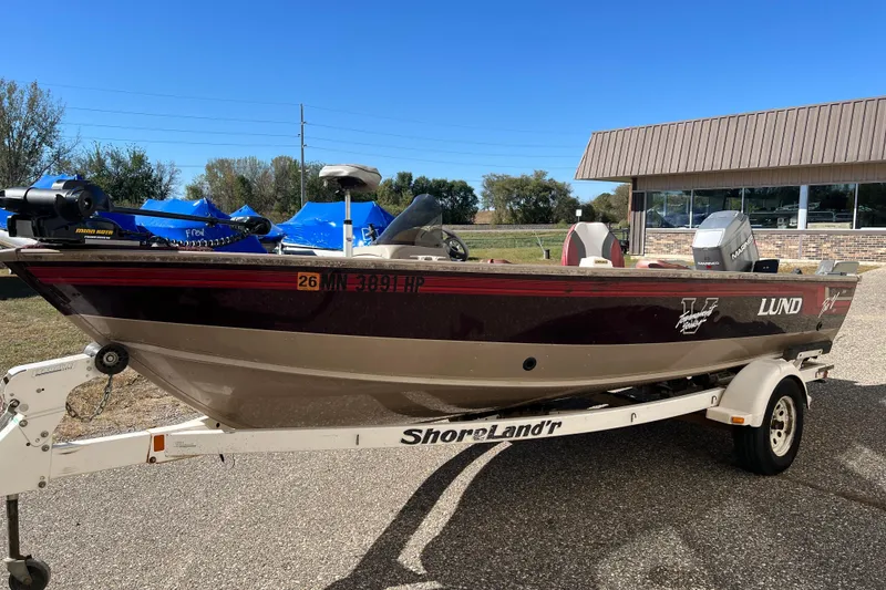 Slide: The Image of 1996 Lund 1800 Pro-V SE boat on ShoreLand'r trailer, parked outdoors. - 3