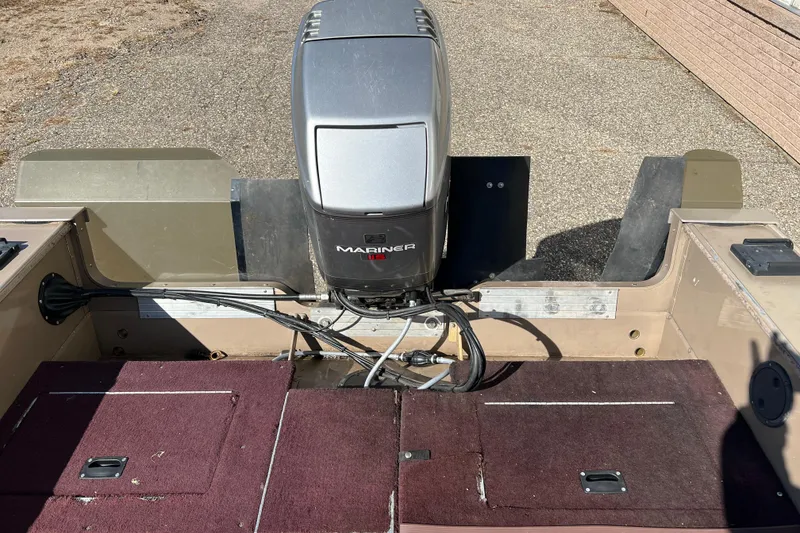 Slide: The Image of 1996 Lund 1800 Pro-V SE boat with Mariner outboard motor, viewed from the rear deck. - 4