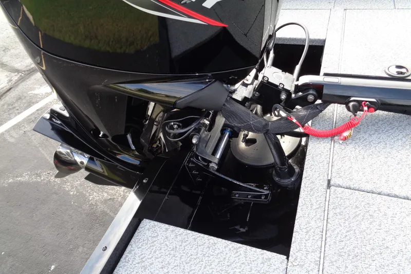 Slide: The Image of 2026 Lund 1800 Explorer Tiller boat engine detail with sleek black finish. - 15