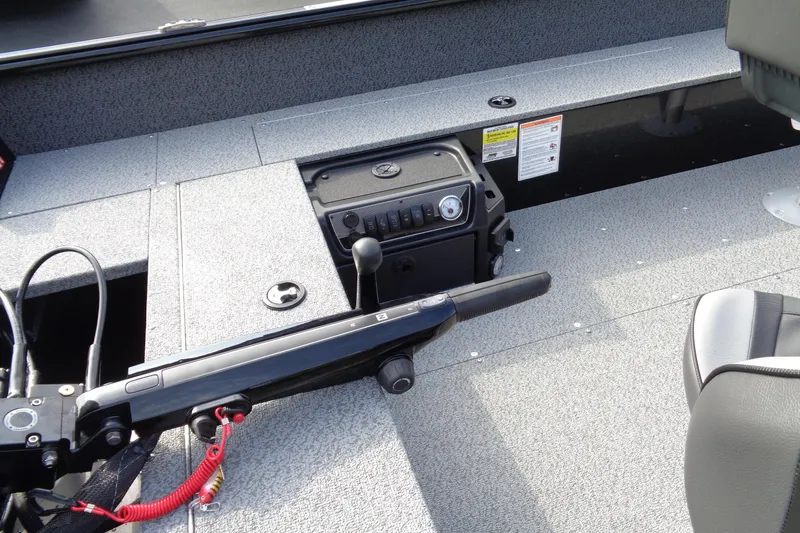 Slide: The Image of 2026 Lund 1800 Explorer Tiller boat interior with control panel and seating. - 16