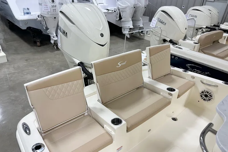 Slide: The Image of 2026 Scout 261 XSS boat interior with beige seating and Yamaha outboard engines. - 14