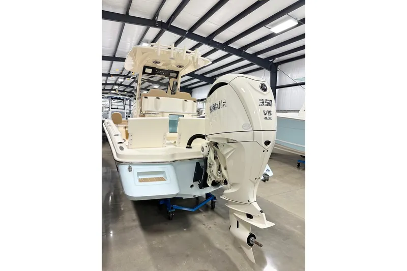 Slide: The Image of 2026 Scout 261 XSS boat with Yamaha 350 V6 engine in showroom. - 15