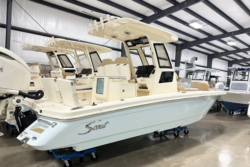 The Image of 2026 Scout 261 XSS boat in showroom, featuring sleek design and modern amenities. - 2