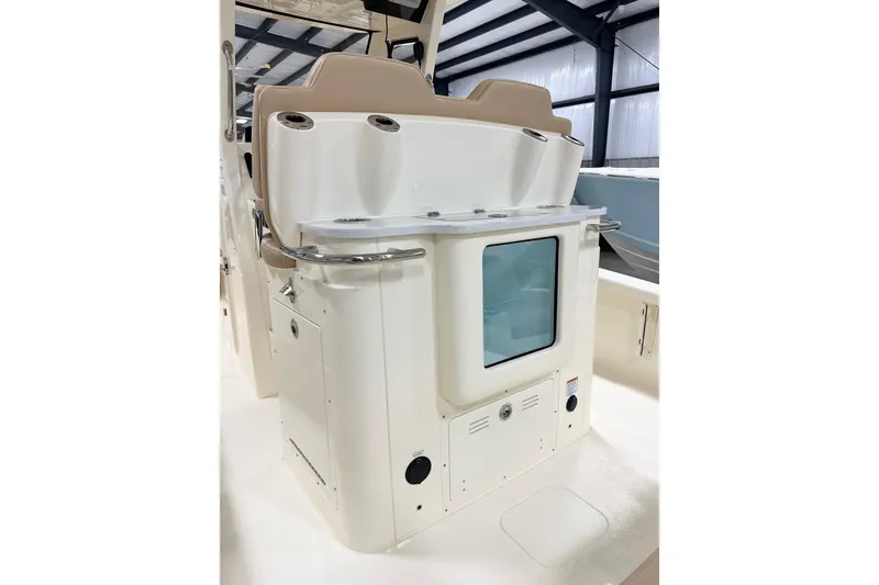 Slide: The Image of 2026 Scout 261 XSS boat interior with seating and storage features. - 6