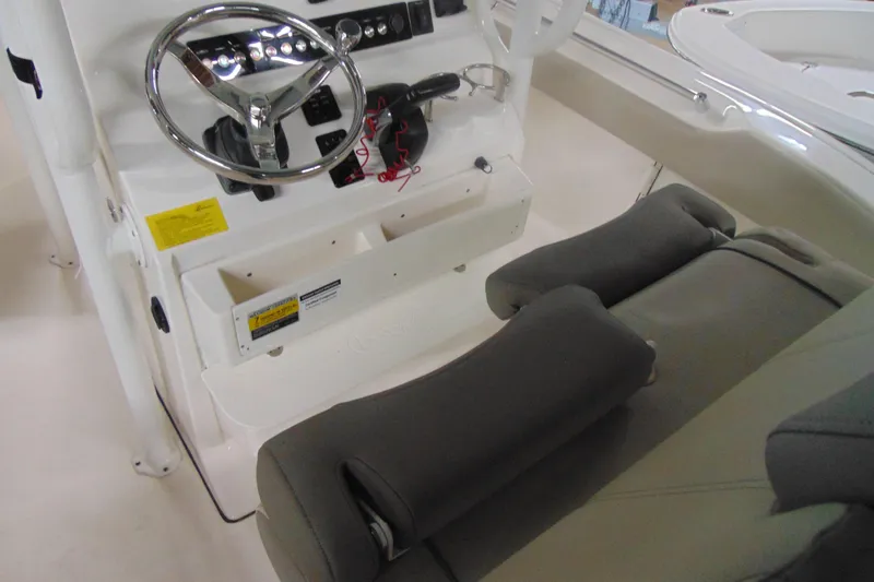 Slide: The Image of 2022 Key West 219 FS boat interior with steering wheel and seating. - 6