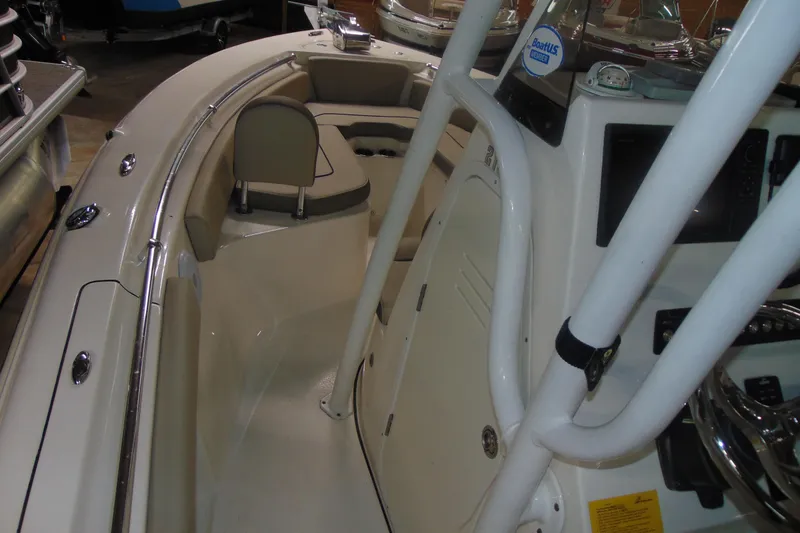 Slide: The Image of 2022 Key West 219 FS boat interior with seating and console details. - 7