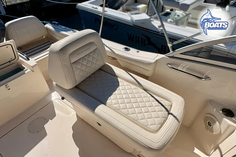 Slide: The Image of Luxurious seating on 2018 Grady-White Freedom 215 boat, featuring diamond-stitched upholstery. - 11