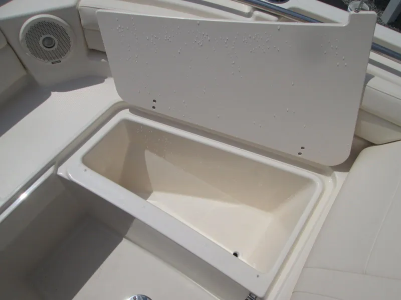 Slide: The Image of Storage compartment on 2018 Grady-White Freedom 215 boat, open lid, beige interior. - 7