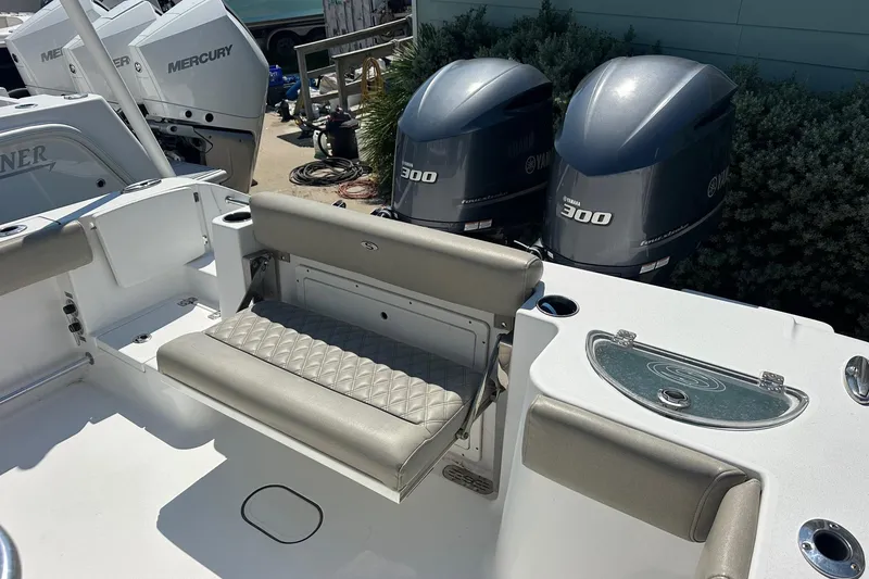 Slide: The Image of 2021 Sportsman Open 282 Center Console with dual Yamaha 300 engines, featuring comfortable seating. - 8