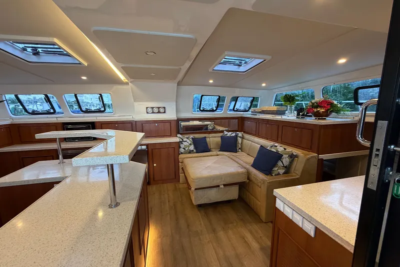 Slide: The Image of Luxurious interior of 2023 Royal Cape Catamarans Majestic 530 with modern seating and elegant decor. - 107