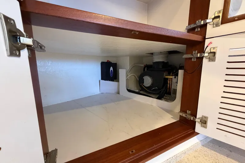 Slide: The Image of Interior storage compartment of 2023 Royal Cape Catamarans Majestic 530, featuring mechanical equipment. - 111