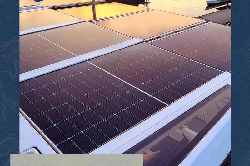 Slide: The Image of Solar panels on 2023 Royal Cape Catamarans Majestic 530, reflecting sunset light. - 118