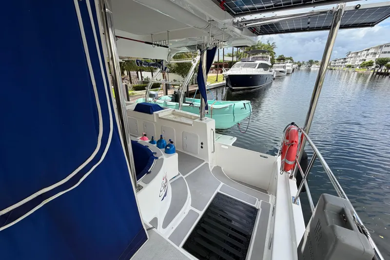 Slide: The Image of 2023 Royal Cape Catamarans Majestic 530 docked, featuring spacious deck and modern amenities. - 14