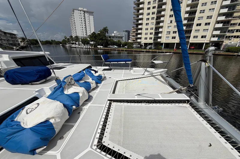 Slide: The Image of 2023 Royal Cape Catamarans Majestic 530 docked near waterfront buildings. - 29