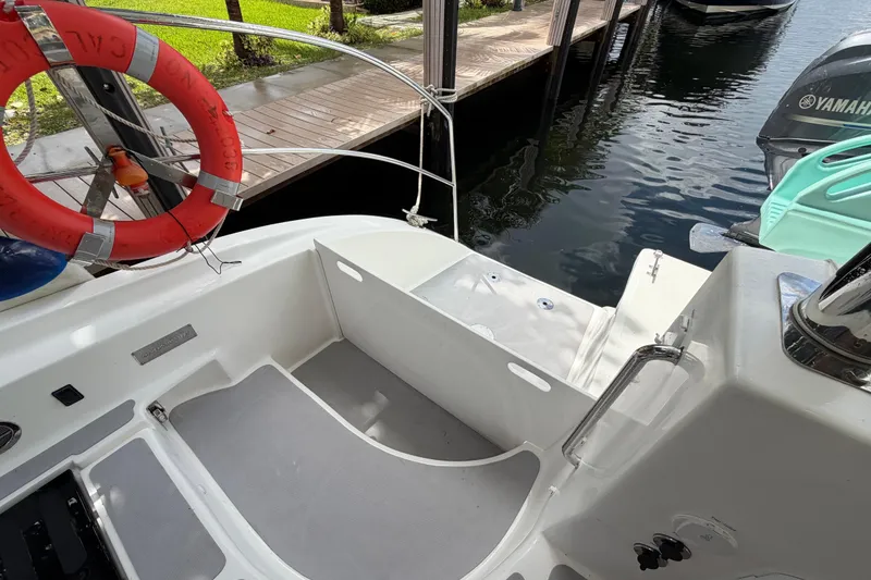 Slide: The Image of 2023 Royal Cape Catamarans Majestic 530 docked, featuring a clean deck and safety equipment. - 35