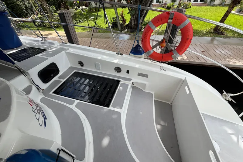 Slide: The Image of 2023 Royal Cape Catamarans Majestic 530 deck with safety ring and dock view. - 36