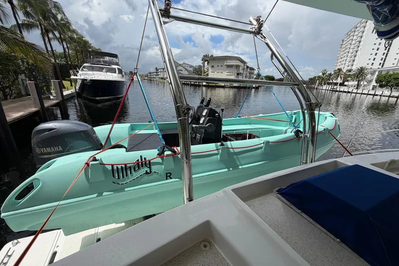 Slide: The Image of Catamaran Majestic 530 with Whaly boat and Yamaha engine docked by waterfront. - 40