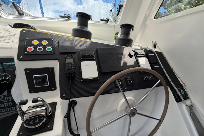 Slide: The Image of Helm of 2023 Royal Cape Catamarans Majestic 530, featuring modern controls and navigation equipment. - 42