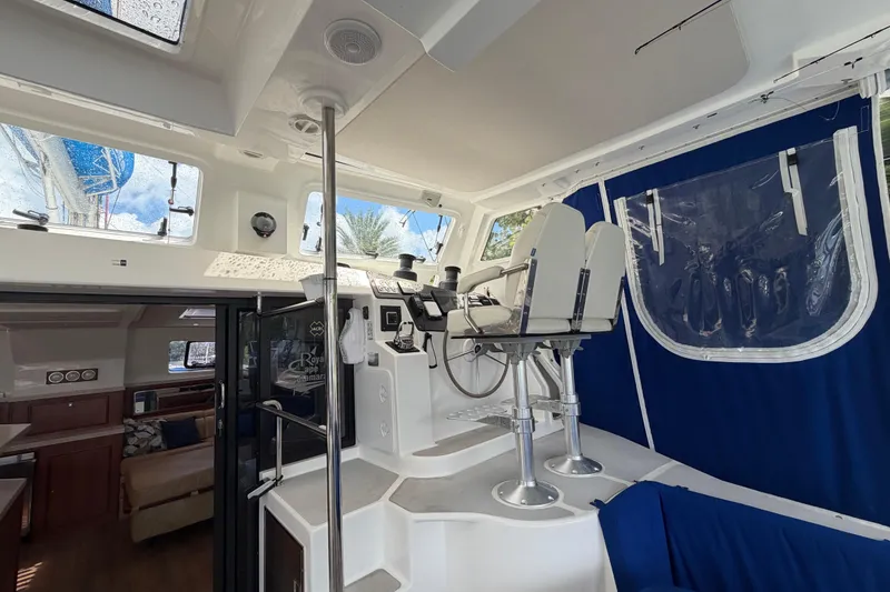 Slide: The Image of 2023 Royal Cape Catamarans Majestic 530 helm station with modern seating and navigation equipment. - 44