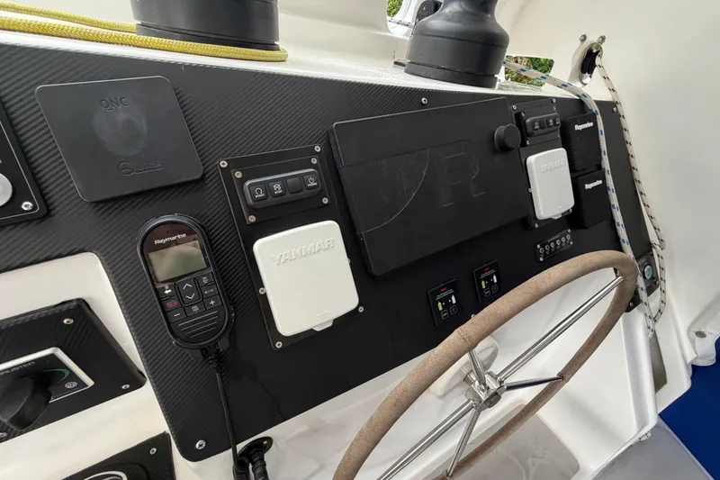 Slide: The Image of Control panel of 2023 Royal Cape Catamarans Majestic 530 with steering wheel and navigation equipment. - 53