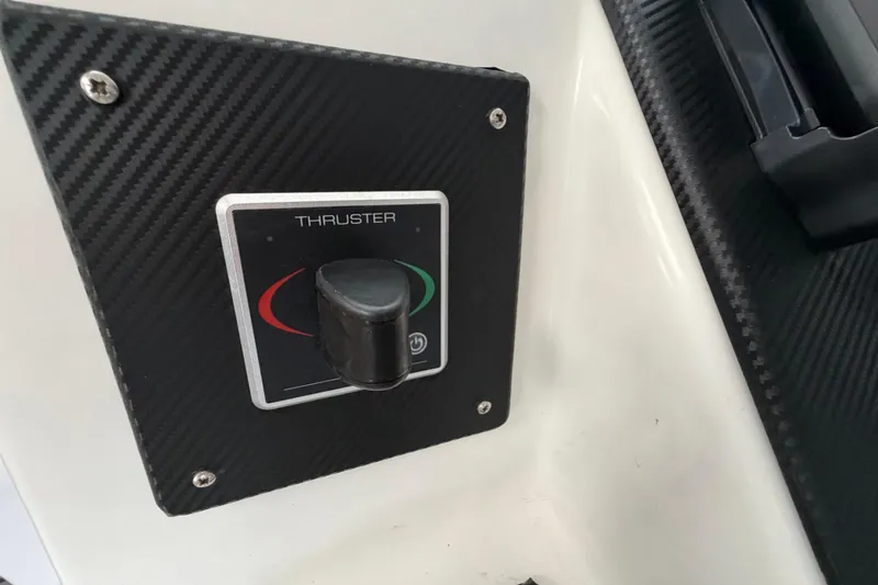 Slide: The Image of Thruster control panel on 2023 Royal Cape Catamarans Majestic 530, carbon fiber finish. - 54