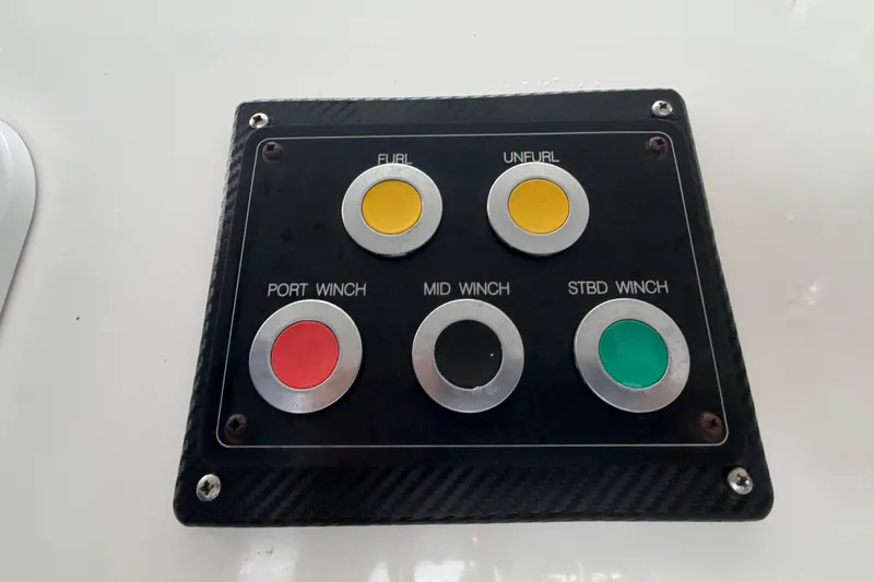 Slide: The Image of Control panel on 2023 Royal Cape Catamarans Majestic 530 with winch and sail buttons. - 56