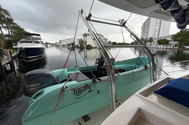 Slide: The Image of 2023 Royal Cape Catamarans Majestic 530 with Yamaha motor in a marina setting. - 61