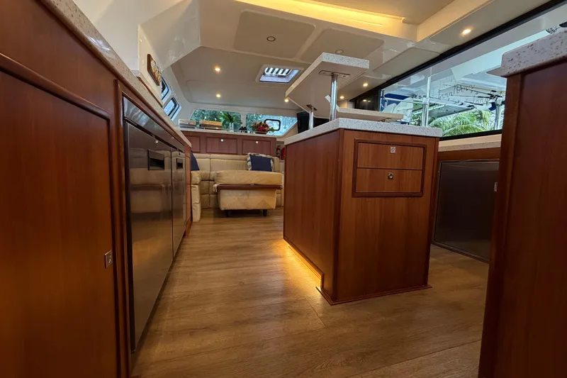 Slide: The Image of Luxurious interior of 2023 Royal Cape Catamarans Majestic 530 with modern wood finishes. - 62