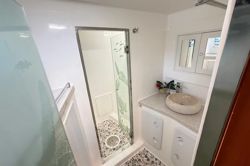 Slide: The Image of Luxurious bathroom in 2023 Royal Cape Catamarans Majestic 530 with modern shower and stone sink. - 74