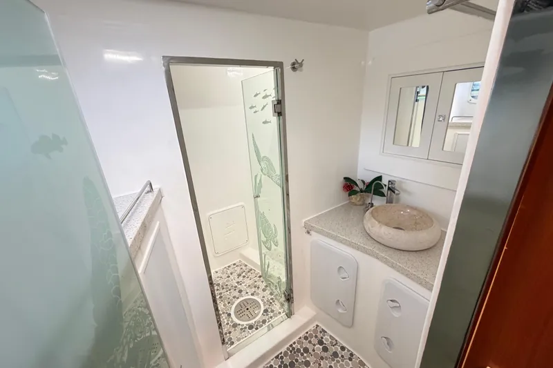 Slide: The Image of Luxurious bathroom in 2023 Royal Cape Catamarans Majestic 530 with modern shower and elegant sink. - 75