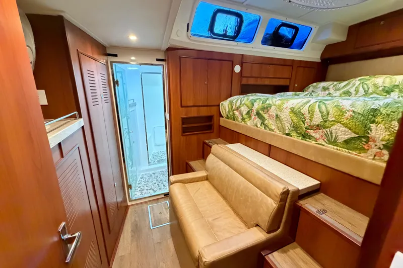 Slide: The Image of Luxurious interior of 2023 Royal Cape Catamarans Majestic 530 with bed, sofa, and bathroom. - 76