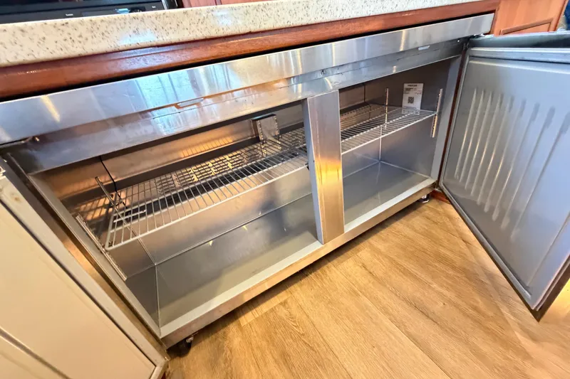 Slide: The Image of Stainless steel refrigerator in 2023 Royal Cape Catamarans Majestic 530 yacht kitchen. - 82