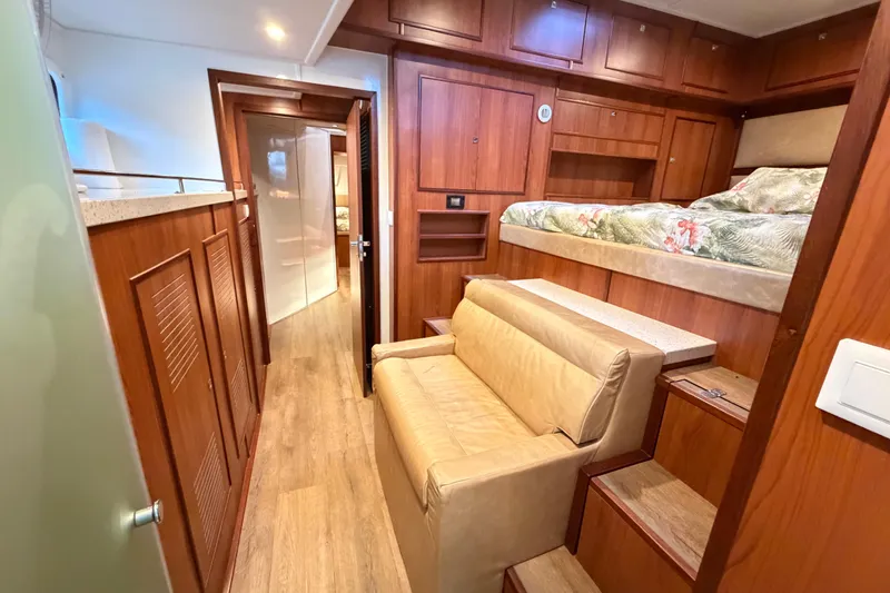 Slide: The Image of Luxurious interior of 2023 Royal Cape Catamarans Majestic 530 with wood finishes and cozy seating. - 91