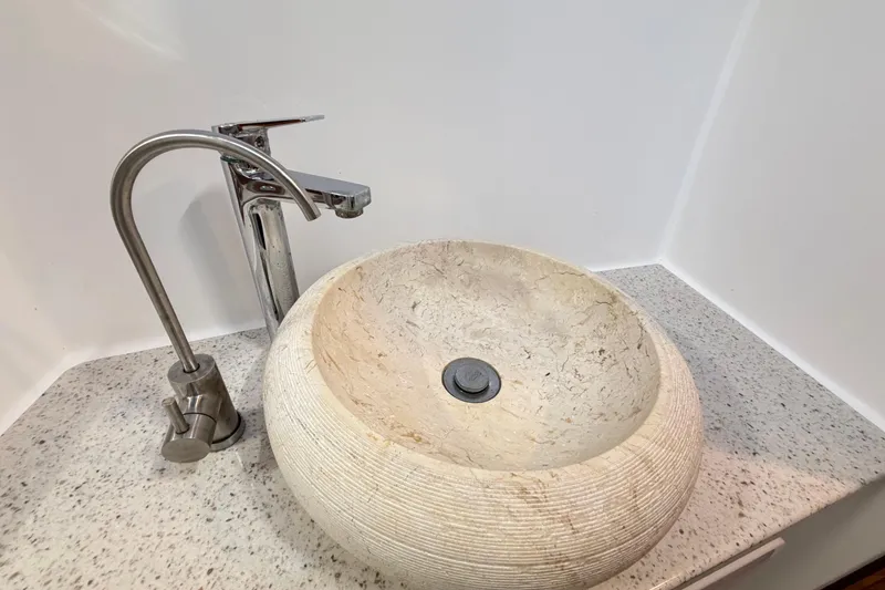 Slide: The Image of Stone vessel sink with modern faucet on Royal Cape Catamarans Majestic 530, 2023 model. - 92