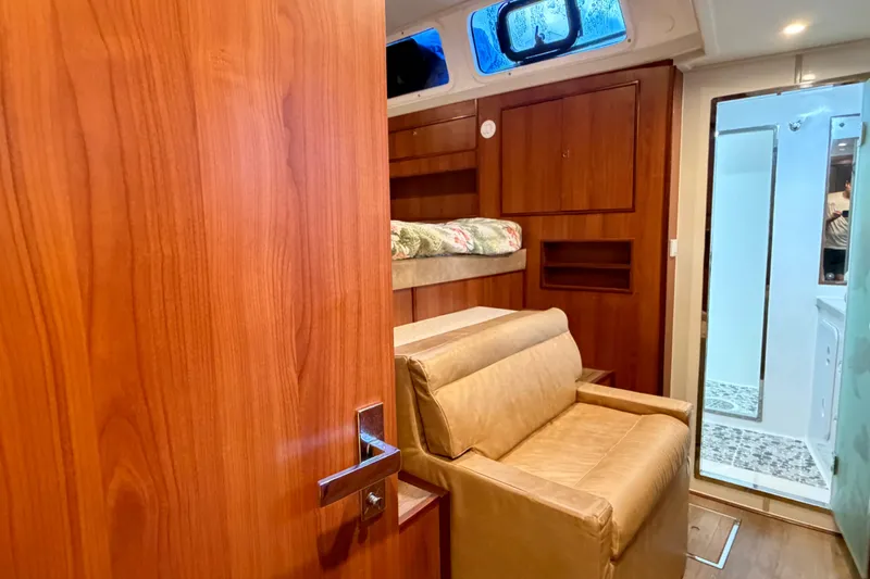 Slide: The Image of Luxurious interior of 2023 Royal Cape Catamarans Majestic 530 with wood finish and cozy seating. - 99