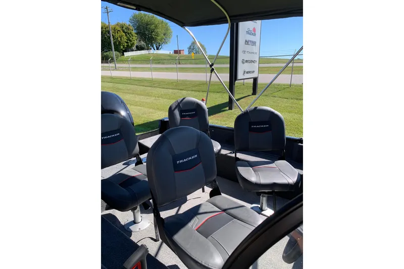 Slide: The Image of 2023 Bass Tracker Pro Guide V-16 WT boat interior with four cushioned seats. - 7