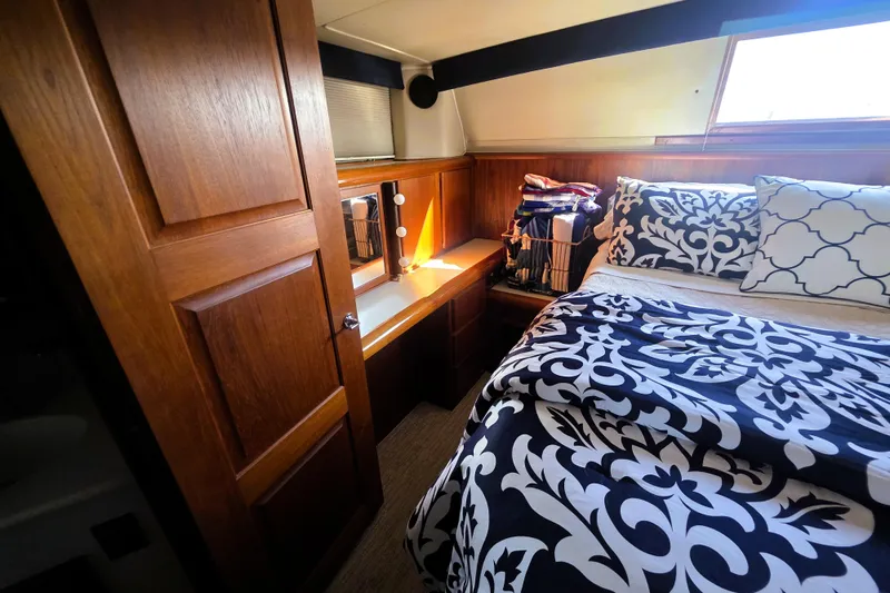 Slide: The Image of Cozy cabin interior of 1990 Californian 48 Cockpit Motor Yacht with elegant bedding. - 34