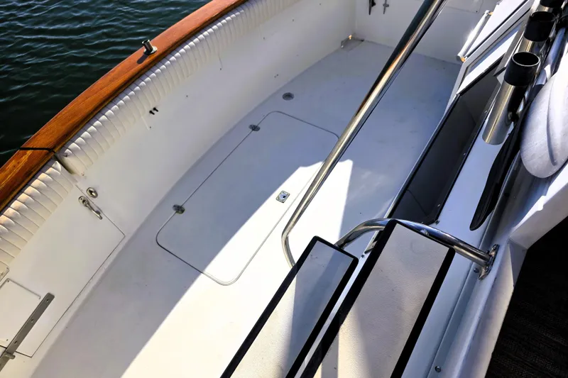 Slide: The Image of 1990 Californian 48 Cockpit Motor Yacht deck with railing and storage hatch. - 4