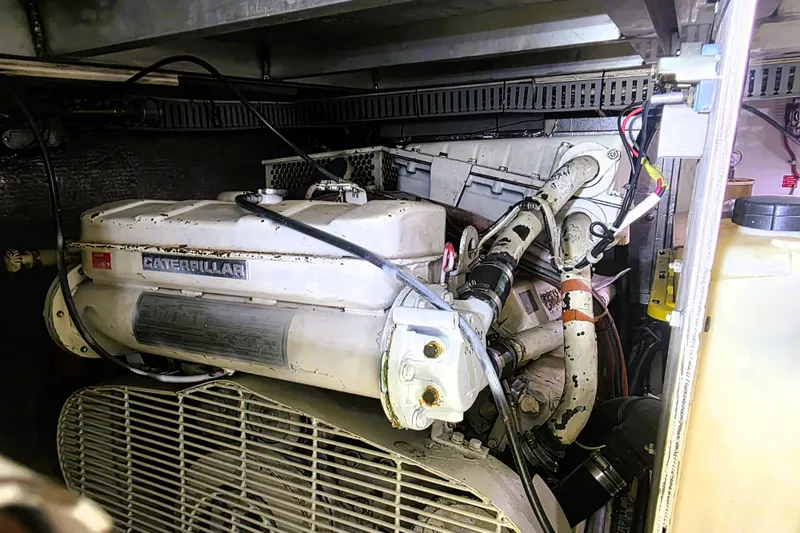 Slide: The Image of Engine room of 1990 Californian 48 Cockpit Motor Yacht with Caterpillar engine. - 49