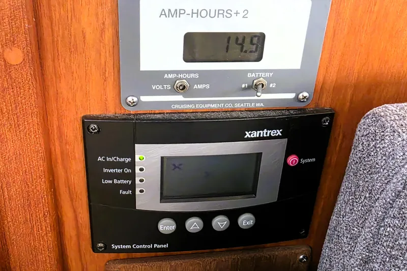 Slide: The Image of Control panel on 1990 Californian 48 Cockpit Motor Yacht, displaying amp-hours and system status. - 53